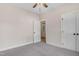 Neutral bedroom featuring carpet flooring, with a closet, and an open door at 56 Birchtop Cir, Zebulon, NC 27597