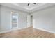 This large bedroom has wood floors, a tray ceiling and access to the bathroom at 56 Birchtop Cir, Zebulon, NC 27597