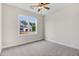 Bright bedroom with neutral carpet and a view of the exterior through the window at 56 Birchtop Cir, Zebulon, NC 27597