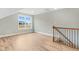 This bonus room features wood-look flooring and stair access at 56 Birchtop Cir, Zebulon, NC 27597