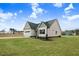Charming new construction home with a well-manicured lawn at 56 Birchtop Cir, Zebulon, NC 27597