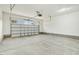 A spacious garage with concrete floors and a garage door at 56 Birchtop Cir, Zebulon, NC 27597