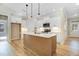 Stylish kitchen features a kitchen island with pendant lights and white cabinets at 56 Birchtop Cir, Zebulon, NC 27597