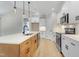 Stylish kitchen with a large center island, stainless appliances, and sleek lighting at 56 Birchtop Cir, Zebulon, NC 27597