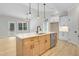 Modern kitchen island with seating, pendant lights, and stainless steel dishwasher at 56 Birchtop Cir, Zebulon, NC 27597