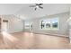 Spacious living room with vaulted ceilings, hardwood floors, and large windows at 56 Birchtop Cir, Zebulon, NC 27597