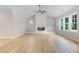 Bright living room features a shiplap fireplace, built-in shelves, and wood-look floors at 56 Birchtop Cir, Zebulon, NC 27597