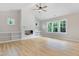 Inviting living room showcases a shiplap fireplace, built-in shelves, and many windows at 56 Birchtop Cir, Zebulon, NC 27597