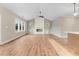 Spacious living room featuring hardwood floors, vaulted ceilings, and a cozy fireplace at 56 Birchtop Cir, Zebulon, NC 27597