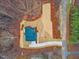 Overhead view of a newly built house with blue shingles on a lot surrounded by tall trees at 596 Oaks Lane Rd, Timberlake, NC 27583