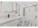 Stylish bathroom features a double sink vanity with decorative tile floors and a shower-tub combo at 596 Oaks Lane Rd, Timberlake, NC 27583