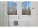 Modern bathroom showcasing a standalone soaking tub with a scenic window view at 596 Oaks Lane Rd, Timberlake, NC 27583