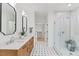 A stylish bathroom features a double vanity, and a spacious glass-enclosed shower at 596 Oaks Lane Rd, Timberlake, NC 27583