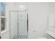 This primary bath includes glass shower and white tiles at 596 Oaks Lane Rd, Timberlake, NC 27583