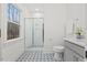 Bathroom featuring a glass shower, geometric floor tiles, and a gray vanity at 596 Oaks Lane Rd, Timberlake, NC 27583