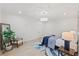 Spacious bedroom features contemporary decor, a cozy seating area, and ample natural light at 596 Oaks Lane Rd, Timberlake, NC 27583