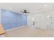 Spacious bedroom with a custom paneled blue wall and wood-look flooring at 596 Oaks Lane Rd, Timberlake, NC 27583