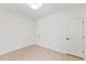 A bright bedroom featuring light wood floors, white walls, and access to ensuite bathroom at 596 Oaks Lane Rd, Timberlake, NC 27583