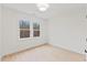 Cozy bedroom with natural light, hardwood floors, fresh paint, and modern ceiling fan at 596 Oaks Lane Rd, Timberlake, NC 27583