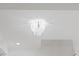 A stylish, modern chandelier illuminates the ceiling, highlighting architectural details and providing elegant lighting at 596 Oaks Lane Rd, Timberlake, NC 27583