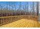 An outdoor wooden deck is surrounded by bare trees at 596 Oaks Lane Rd, Timberlake, NC 27583