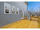 View of exterior with a wood deck, a door and white-framed windows at 596 Oaks Lane Rd, Timberlake, NC 27583