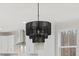 Modern kitchen features an elegant chandelier, bright lighting, and stylish cabinetry at 596 Oaks Lane Rd, Timberlake, NC 27583