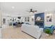 Open-concept living space with fireplace, modern furniture, and seamless flow into the kitchen and dining areas at 596 Oaks Lane Rd, Timberlake, NC 27583