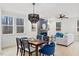 Bright, open-concept living space with a dining area, fireplace, and comfortable seating with nice natural light at 596 Oaks Lane Rd, Timberlake, NC 27583