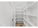 Walk-in pantry featuring white shelving with plenty of storage space at 596 Oaks Lane Rd, Timberlake, NC 27583