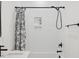 Tiled shower-tub combination with rain shower head, floral shower curtain, and niche for toiletries at 596 Oaks Lane Rd, Timberlake, NC 27583