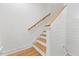 Carpeted stairway with a wooden handrail leads to the upper level of the home at 596 Oaks Lane Rd, Timberlake, NC 27583