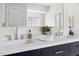 Bathroom detail shows modern double sink vanity with quartz counters and chrome fixtures at 608 Elin Ct, Hillsborough, NC 27278