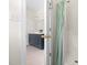 Bright and modern bathroom with shower stall, vanity, and blue cabinet at 608 Elin Ct, Hillsborough, NC 27278