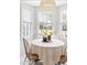 Bright dining area features a bay window offering a pleasant view of the backyard at 608 Elin Ct, Hillsborough, NC 27278