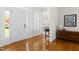 Bright foyer with gleaming hardwood floors and elegant white trim, offering a grand entrance to the home at 608 Elin Ct, Hillsborough, NC 27278