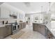 Spacious kitchen featuring stainless steel appliances, tile floors, and stone countertops at 608 Elin Ct, Hillsborough, NC 27278