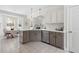 Updated kitchen boasts stone countertops, stainless steel appliances, and modern fixtures at 608 Elin Ct, Hillsborough, NC 27278