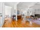 Open-concept living room with hardwood floors, fireplace, and lots of natural light, perfect for entertaining guests at 608 Elin Ct, Hillsborough, NC 27278