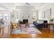 Bright living room boasts a fireplace, modern furnishings, and tray ceiling for a cozy yet elegant space at 608 Elin Ct, Hillsborough, NC 27278