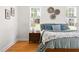 Close up of the main bedroom featuring hardwood floors, natural light, and neutral walls at 608 Elin Ct, Hillsborough, NC 27278