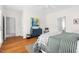 Spacious main bedroom suite with hardwood floors and ensuite bathroom at 608 Elin Ct, Hillsborough, NC 27278