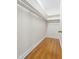Walk-in closet with hardwood flooring and custom shelving at 608 Elin Ct, Hillsborough, NC 27278