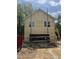 Exterior featuring a two-car garage and freshly installed vinyl siding at 618 Price Ave, Durham, NC 27701