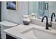 Bathroom close-up with a white quartz countertop and modern faucet at 631 Linfield Dr, Durham, NC 27701