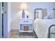 Bedroom detail showing a nightstand with stylish decor and a comfortable bed at 631 Linfield Dr, Durham, NC 27701