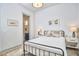 Cozy bedroom featuring neutral colors and an en-suite bathroom at 631 Linfield Dr, Durham, NC 27701