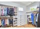 Organized walk-in closet with custom shelving, drawers, and ample hanging space, perfect for wardrobe storage at 631 Linfield Dr, Durham, NC 27701