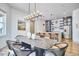 Open dining area with a view to the kitchen and backyard at 631 Linfield Dr, Durham, NC 27701