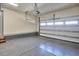 Clean garage with epoxy flooring and ample space for parking and storage, ensuring an organized area at 631 Linfield Dr, Durham, NC 27701